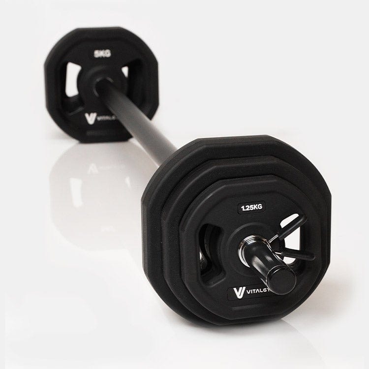 Various weight plates included in the Vital Gym Barbell Weight Set, designed for customizable strength training