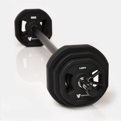 Various weight plates included in the Vital Gym Barbell Weight Set, designed for customizable strength training